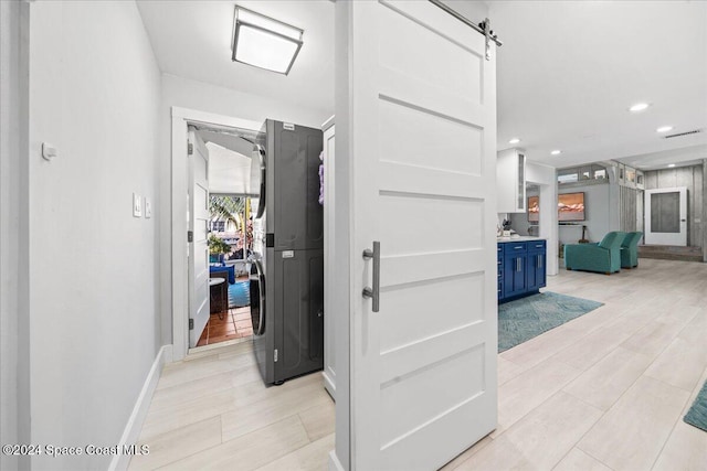 hallway featuring a barn door