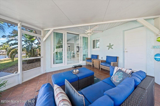 sunroom featuring ceiling fan