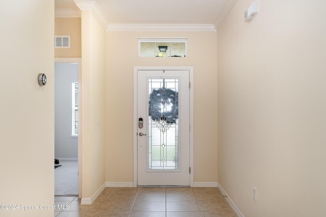 tiled foyer with crown molding