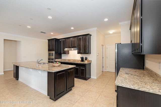 kitchen featuring light stone countertops, appliances with stainless steel finishes, ornamental molding, light tile patterned floors, and an island with sink