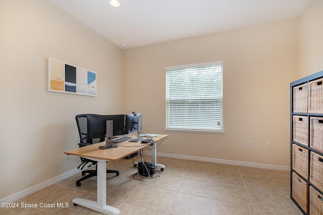 office area with light tile patterned floors