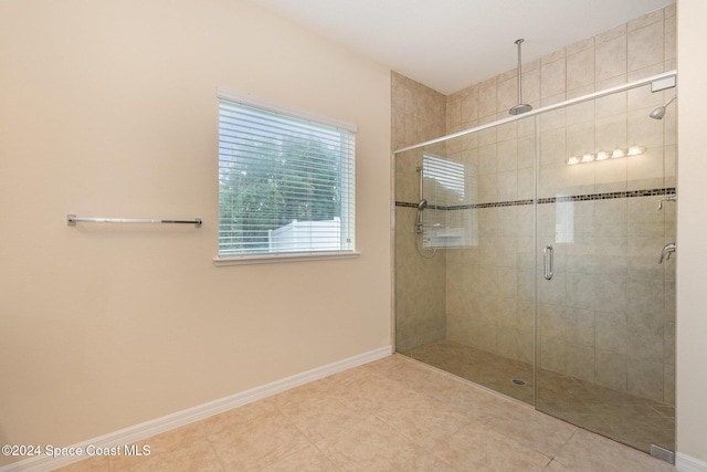 bathroom featuring tile patterned floors and walk in shower