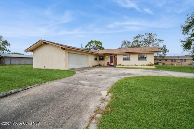 ranch-style house with a front lawn and a garage