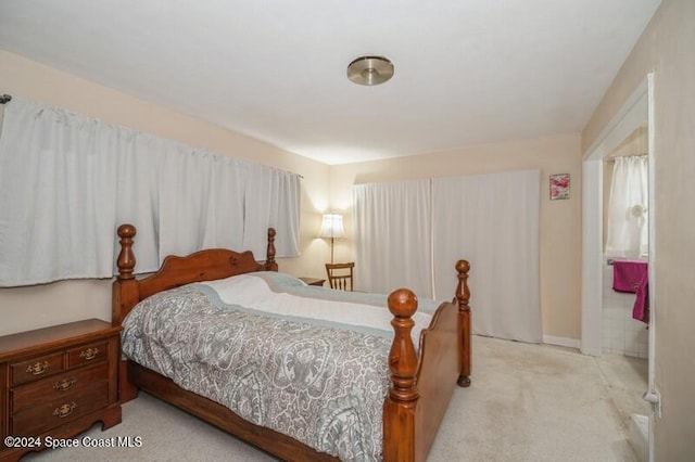 bedroom featuring light colored carpet