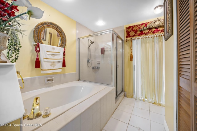 bathroom featuring separate shower and tub and tile patterned flooring