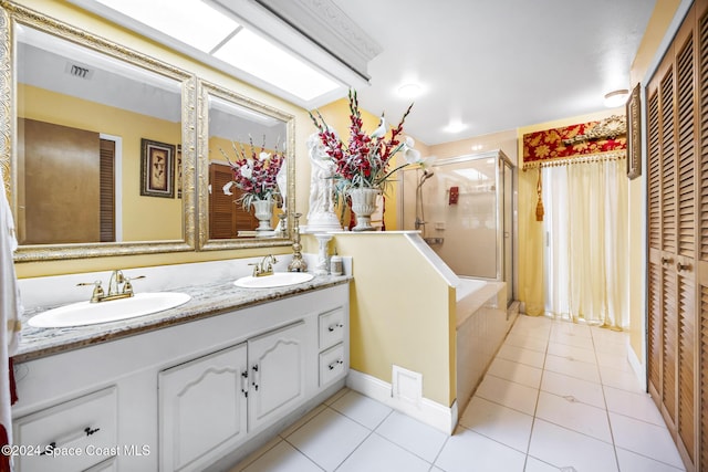 bathroom with plus walk in shower, vanity, and tile patterned flooring