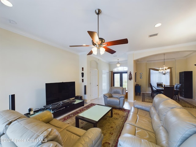 living room with crown molding, french doors, and ceiling fan with notable chandelier