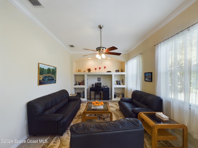 living room featuring built in shelves, ceiling fan, and ornamental molding