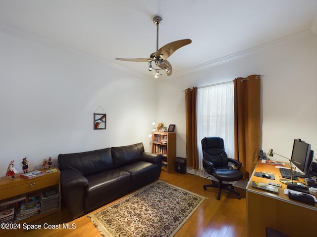 living room with crown molding, ceiling fan, and hardwood / wood-style flooring