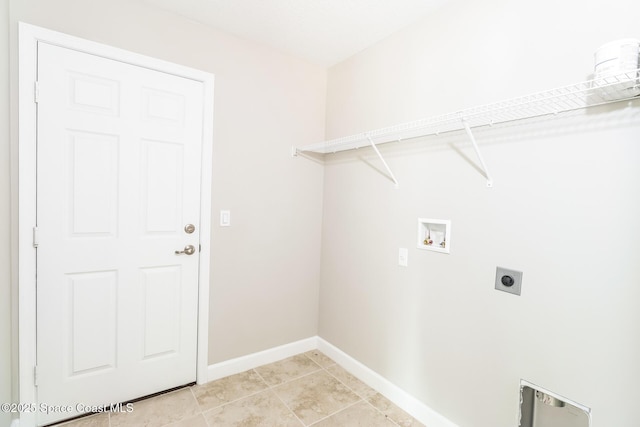 washroom with light tile patterned floors, hookup for a washing machine, and electric dryer hookup