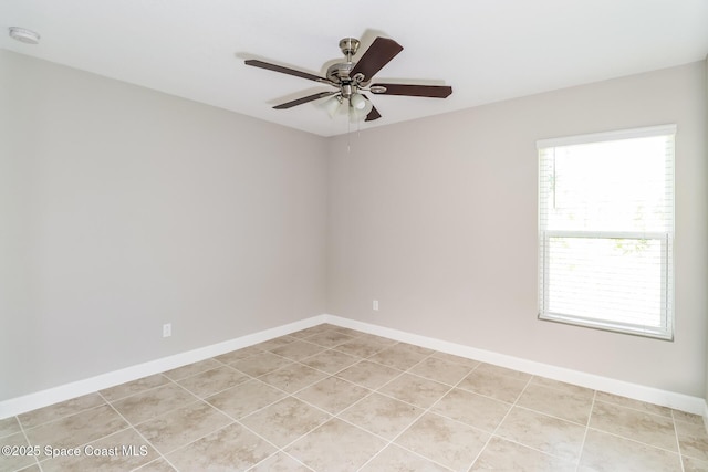 tiled empty room with ceiling fan