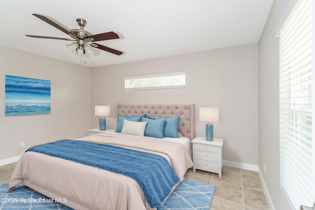 tiled bedroom with ceiling fan