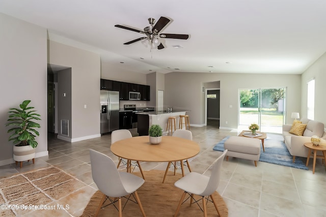 dining area with lofted ceiling and ceiling fan