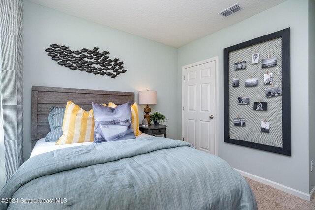 bedroom featuring carpet