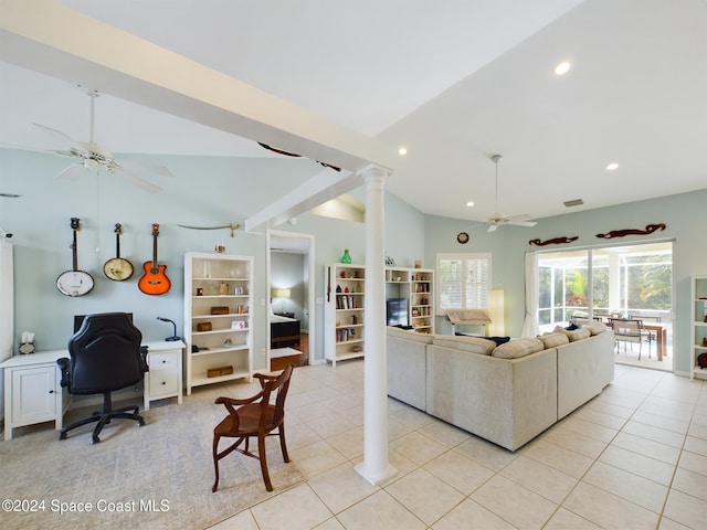 living room with light tile patterned floors, vaulted ceiling, ceiling fan, and ornate columns