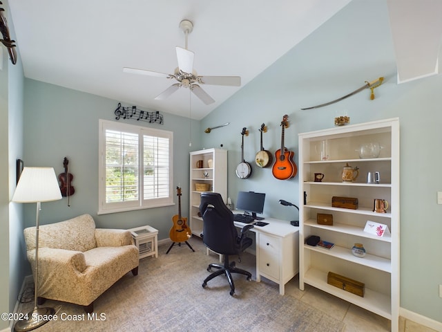 tiled office space with ceiling fan and vaulted ceiling