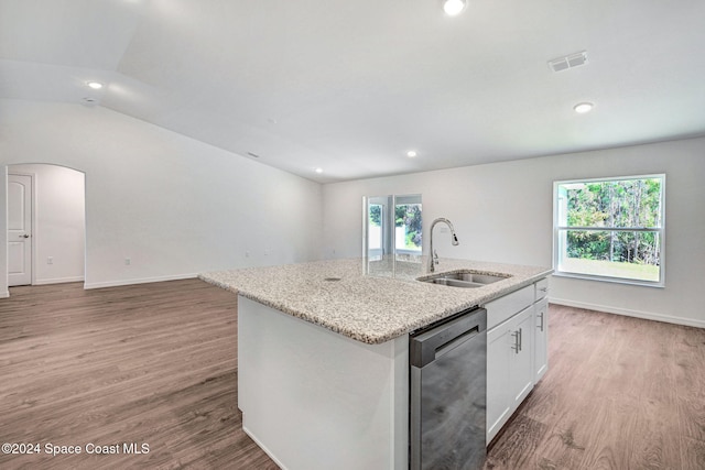 kitchen featuring white cabinets, sink, stainless steel dishwasher, an island with sink, and wood-type flooring