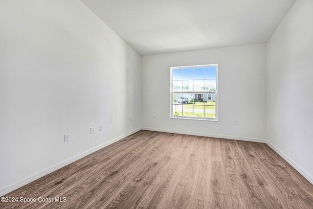 unfurnished room featuring light hardwood / wood-style floors