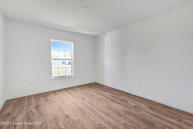 unfurnished room with light hardwood / wood-style floors