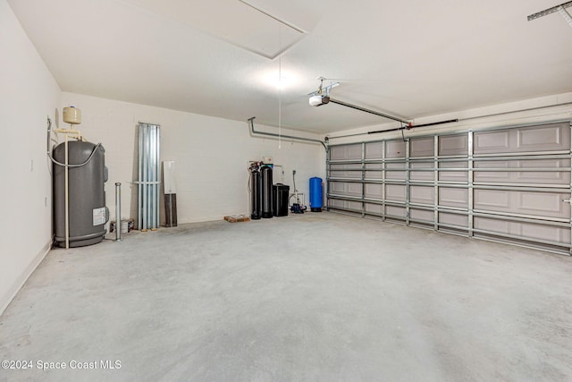 garage with electric water heater and a garage door opener