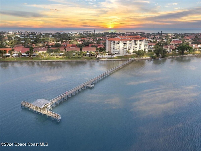 aerial view at dusk with a water view