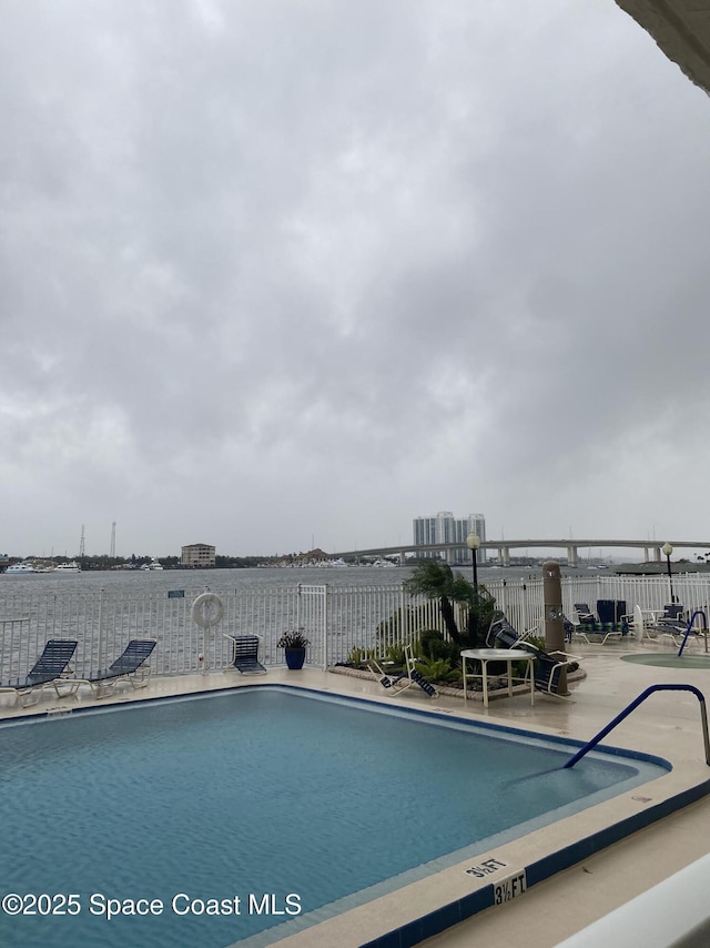 view of swimming pool with a patio