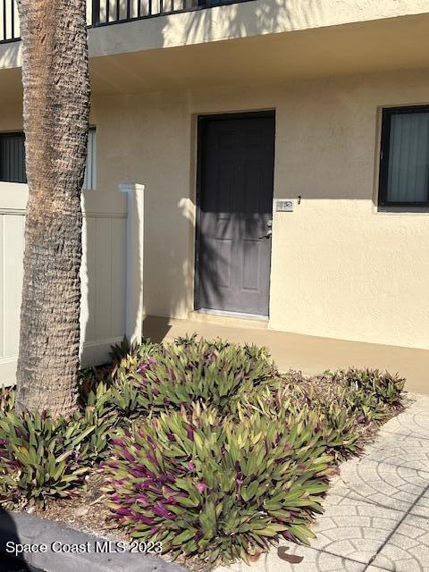 entrance to property with a balcony