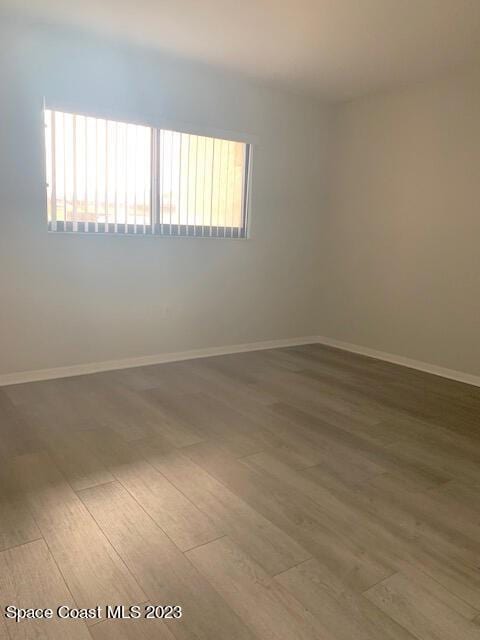 spare room featuring hardwood / wood-style floors