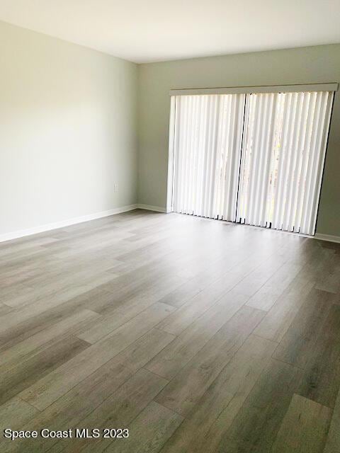 spare room with hardwood / wood-style flooring