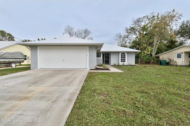 single story home with a front yard and a garage