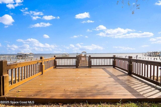 wooden deck with a water view