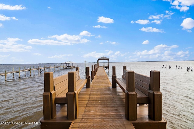 view of dock with a water view