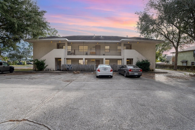 view of outdoor building at dusk