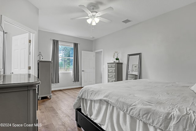 bedroom featuring ceiling fan and light hardwood / wood-style floors