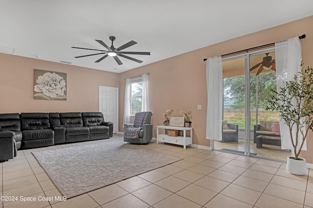 tiled living room with ceiling fan