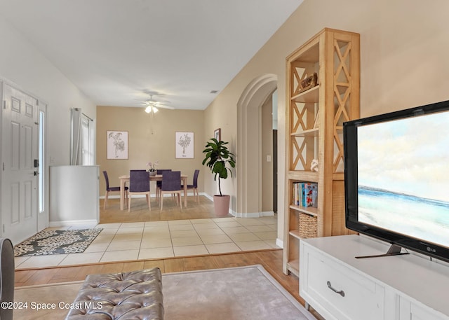 interior space featuring a wealth of natural light, light hardwood / wood-style flooring, and ceiling fan