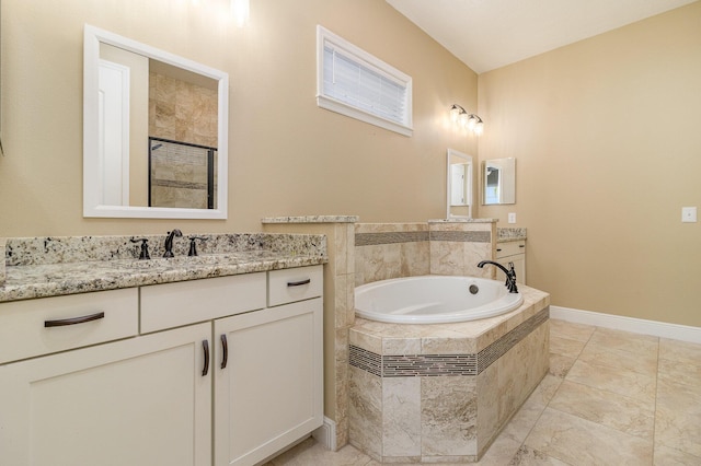 bathroom featuring separate shower and tub and vanity