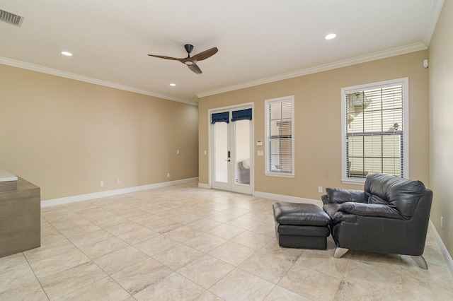 sitting room with light tile patterned floors, ceiling fan, and ornamental molding