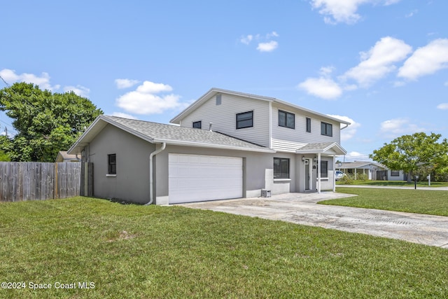 view of front property with a garage and a front lawn