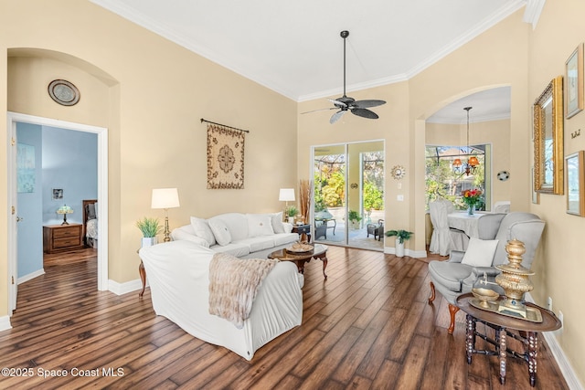 living room with french doors, dark hardwood / wood-style floors, ceiling fan, and crown molding