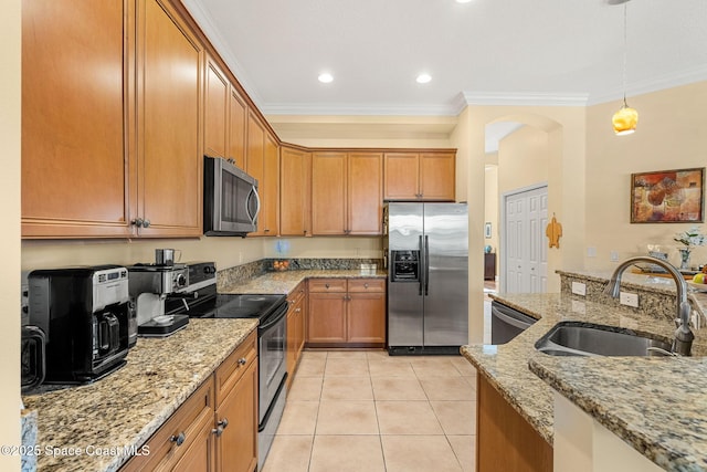 kitchen featuring sink, light stone countertops, decorative light fixtures, light tile patterned flooring, and stainless steel appliances