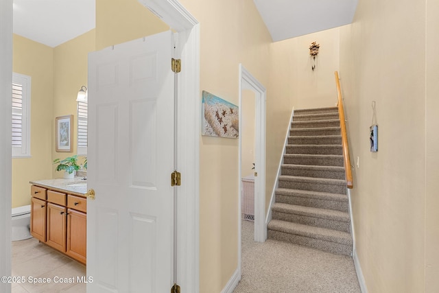 stairs featuring sink