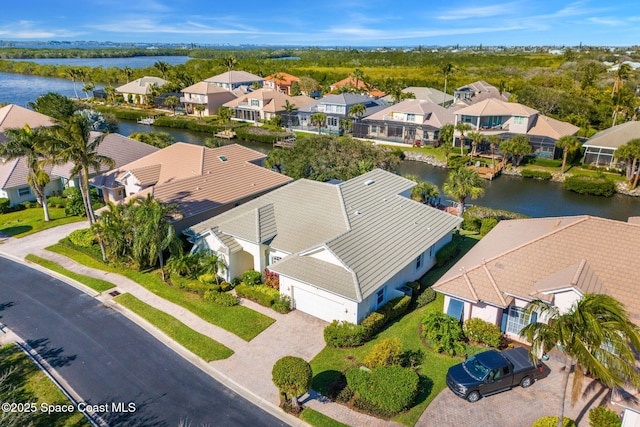 birds eye view of property featuring a water view