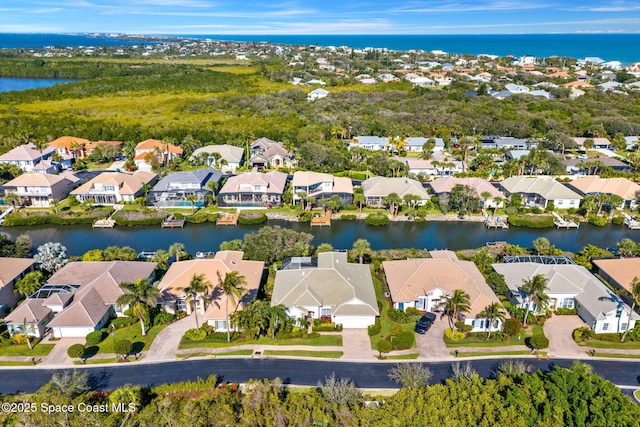 drone / aerial view featuring a water view