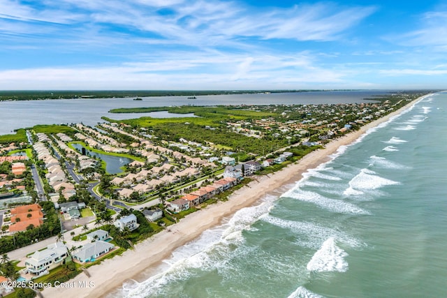 aerial view featuring a water view and a beach view