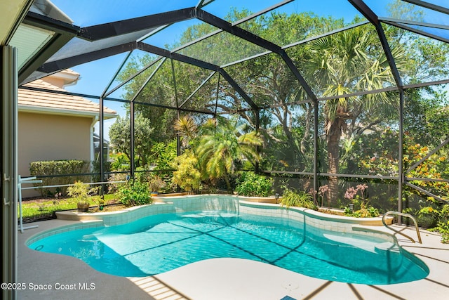 outdoor pool featuring a lanai and a patio area