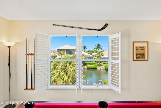 game room featuring a water view
