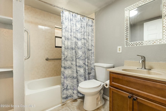 full bathroom with tile patterned floors, vanity, toilet, and shower / bath combo with shower curtain