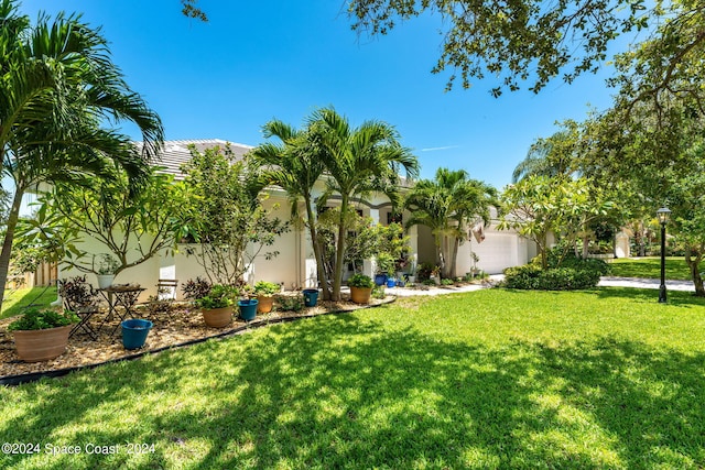 view of yard with a garage