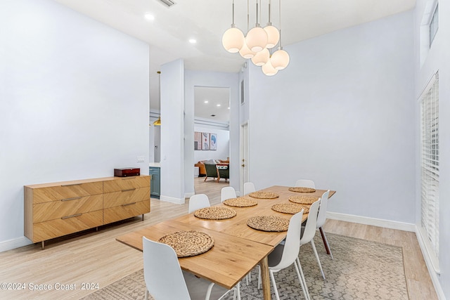 dining space with light hardwood / wood-style flooring